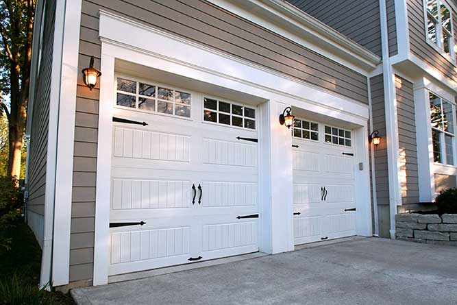 White painted Gallery Collection Doors with decorative hardware and square windows