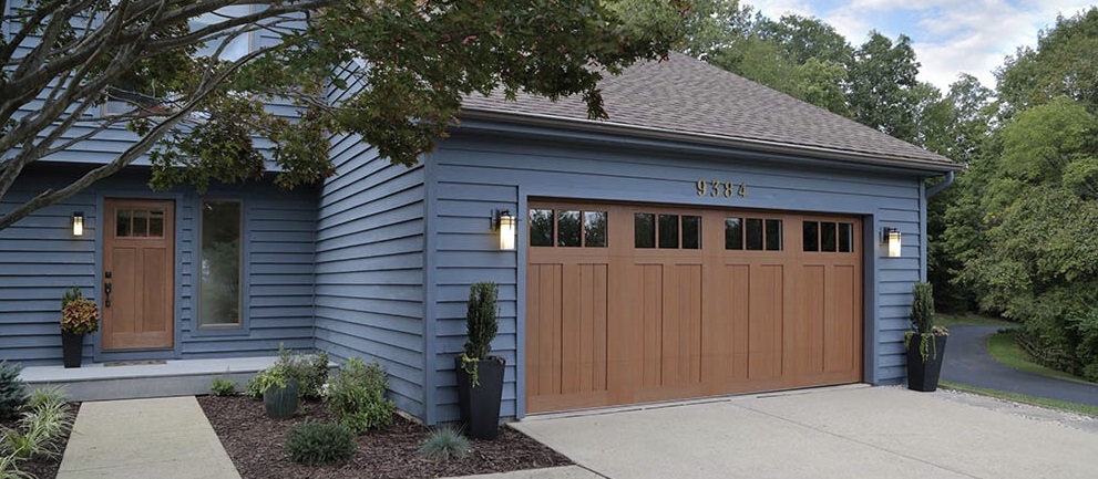 Clopay Canyon Ridge LES Garage Door with matching Craftsman Entry Door Dark Finish
